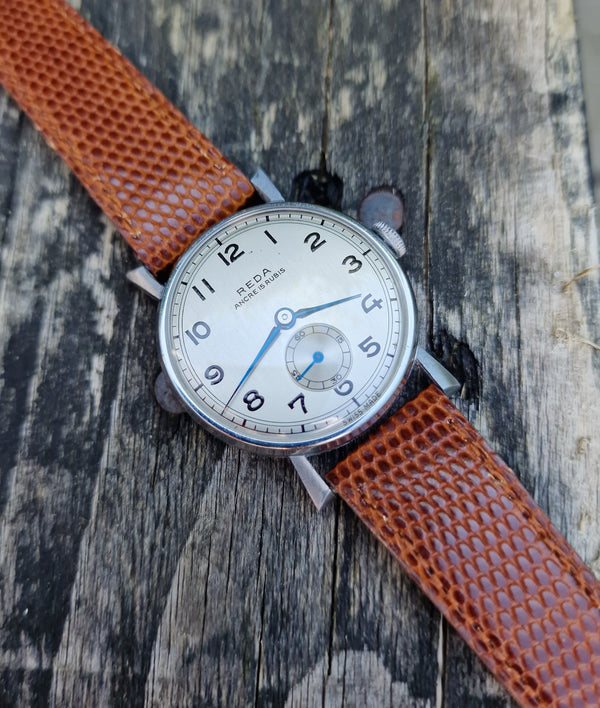 1940s New old stock unused Reda swiss 35mm wristwatch with fancy lugs on leather