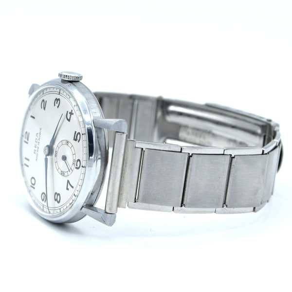 1940s New old stock unused Reda swiss wristwatch with fancy lugs on unusual patented Swiss bracelet