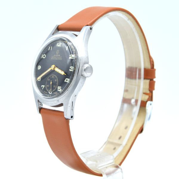 1940s Swiss Sigma military style wristwatch with stunning original gloss black Arabic dial