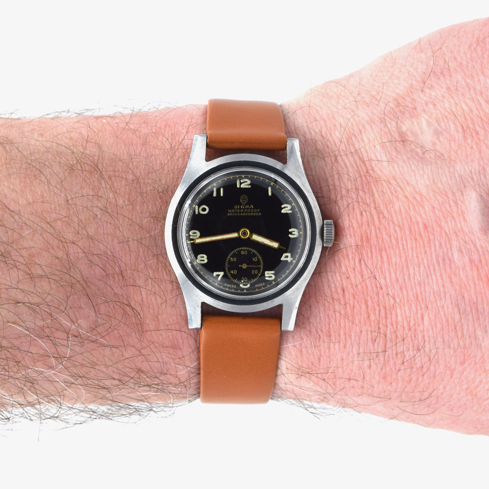 1940s Swiss Sigma military style wristwatch with stunning original gloss black Arabic dial