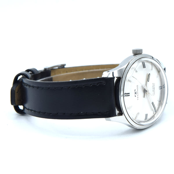 1960s Technos Mid-Size Steel Manual Wind On Leather Strap With Original Signed Buckle – Silver Sunburst Dial
