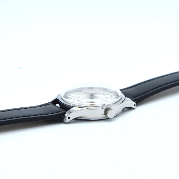 1960s Technos Mid-Size Steel Manual Wind On Leather Strap With Original Signed Buckle – Silver Sunburst Dial