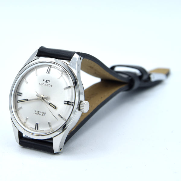 1960s Technos Mid-Size Steel Manual Wind On Leather Strap With Original Signed Buckle – Silver Sunburst Dial