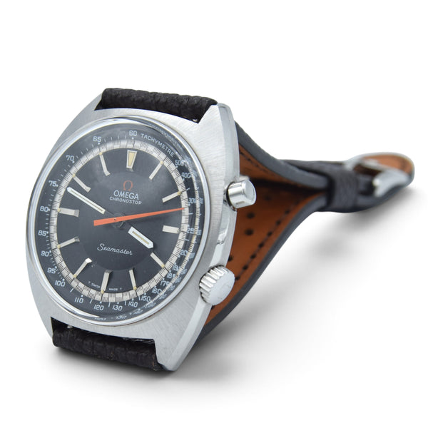 Omega Seamaster wristwatch with a silver-tone case, dark gray dial, orange second hand, and a brown leather strap, shown on a white background.