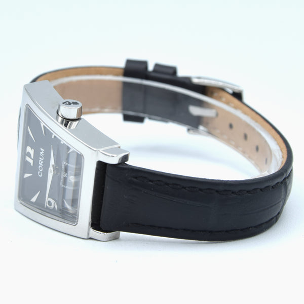 Corum Trapeze ladies ref. 105.404.20 stainless steel quartz watch, black dial with original buckle