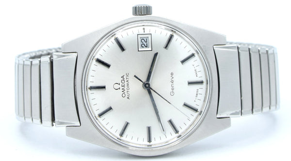 An Omega Automatic wristwatch with a silver stainless steel case and integrated bracelet, featuring a white dial with black stick indices and a date window at the 3 o'clock position.