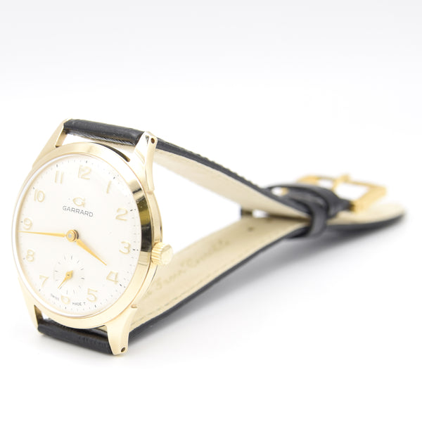 1964 Garrard of London Wristwatch in solid 9ct Gold with all Arabic dial and Original Box