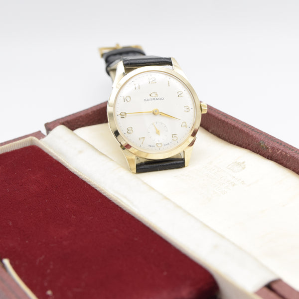 1964 Garrard of London Wristwatch in solid 9ct Gold with all Arabic dial and Original Box