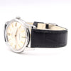 Wristwatch with black leather strap and silver case on a white background