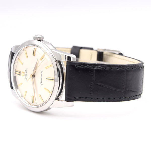 Wristwatch with black leather strap and silver case on a white background