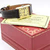 Cartier watch with black leather strap on a red box