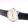 A vintage Rolex wristwatch with a silver-toned stainless steel case, cream-colored dial, and a black alligator leather strap, shown on a white background.