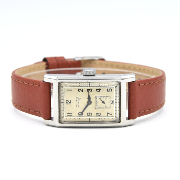 1940 Cyma Tavannes waterspoot Rectangular Early Waterproof Patent Deco Wristwatch with Arabic Dial in steel