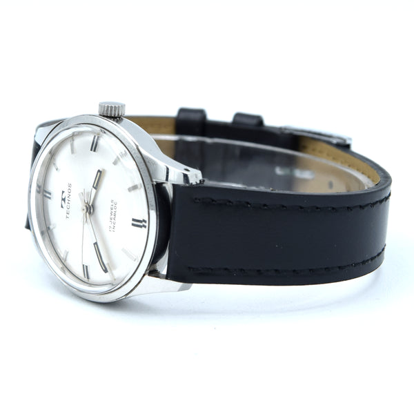 1960s Technos Mid-Size Steel Manual Wind On Leather Strap With Original Signed Buckle – Silver Sunburst Dial