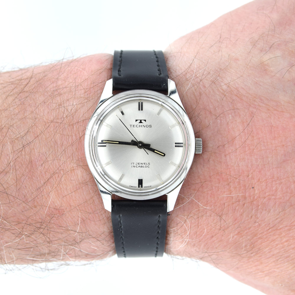 1960s Technos Mid-Size Steel Manual Wind On Leather Strap With Original Signed Buckle – Silver Sunburst Dial