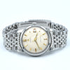 Omega x Swatch Stratomeister wrist watch with a silver-tone stainless steel link bracelet, a cream-colored dial, and gold-tone hands and hour markers.