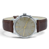 Omega Seamaster wristwatch with a brown textured leather strap, silver-tone case, and a beige dial with gold-tone hands and hour markers.