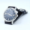 Omega Automatic Geneva watch with a dark gray dial, silver-tone case, and black leather strap, photographed on a clean white background.