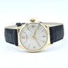 A vintage-style Longines wristwatch with a gold-tone case, white dial, and black leather strap, photographed on a clean white background.