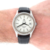 A vintage Omega Automatic cosmic 2000 watch with a silver-toned metal case, white dial, and black leather strap, shown worn on a person's wrist.