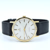 Omega Geneva wristwatch with a gold-tone round case, white dial, and black leather strap, shown against a plain white background.