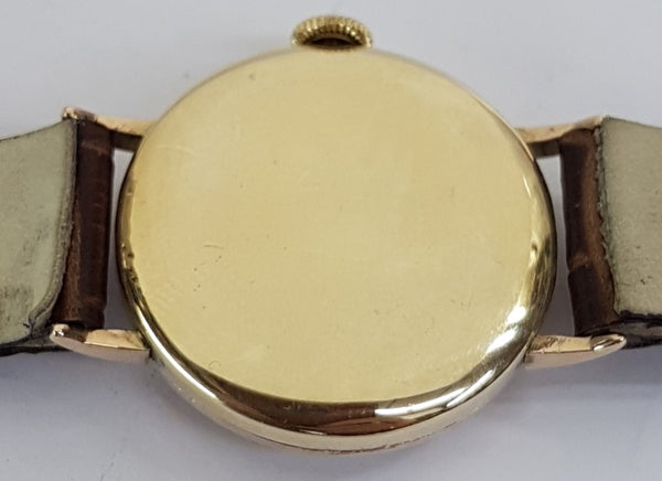 JW Benson & Smiths in solid 9ct Gold. a Dress Watch made in England dated 1950