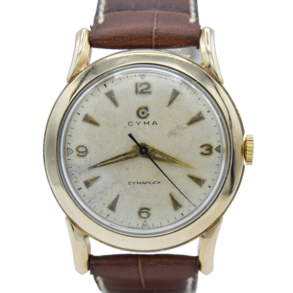 1954 Cyma Cymaflex Wristwatch Bombe style lugs with mixed Arabic Dial arrow batons in solid 9ct Gold with Original Box